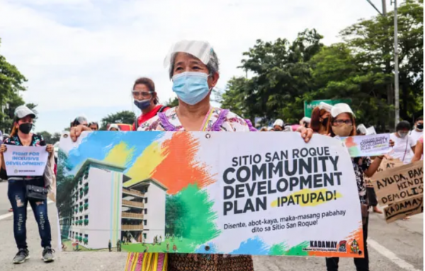 Residents of Sitio San Roque holding a protest action to push for affordable housing for the poor